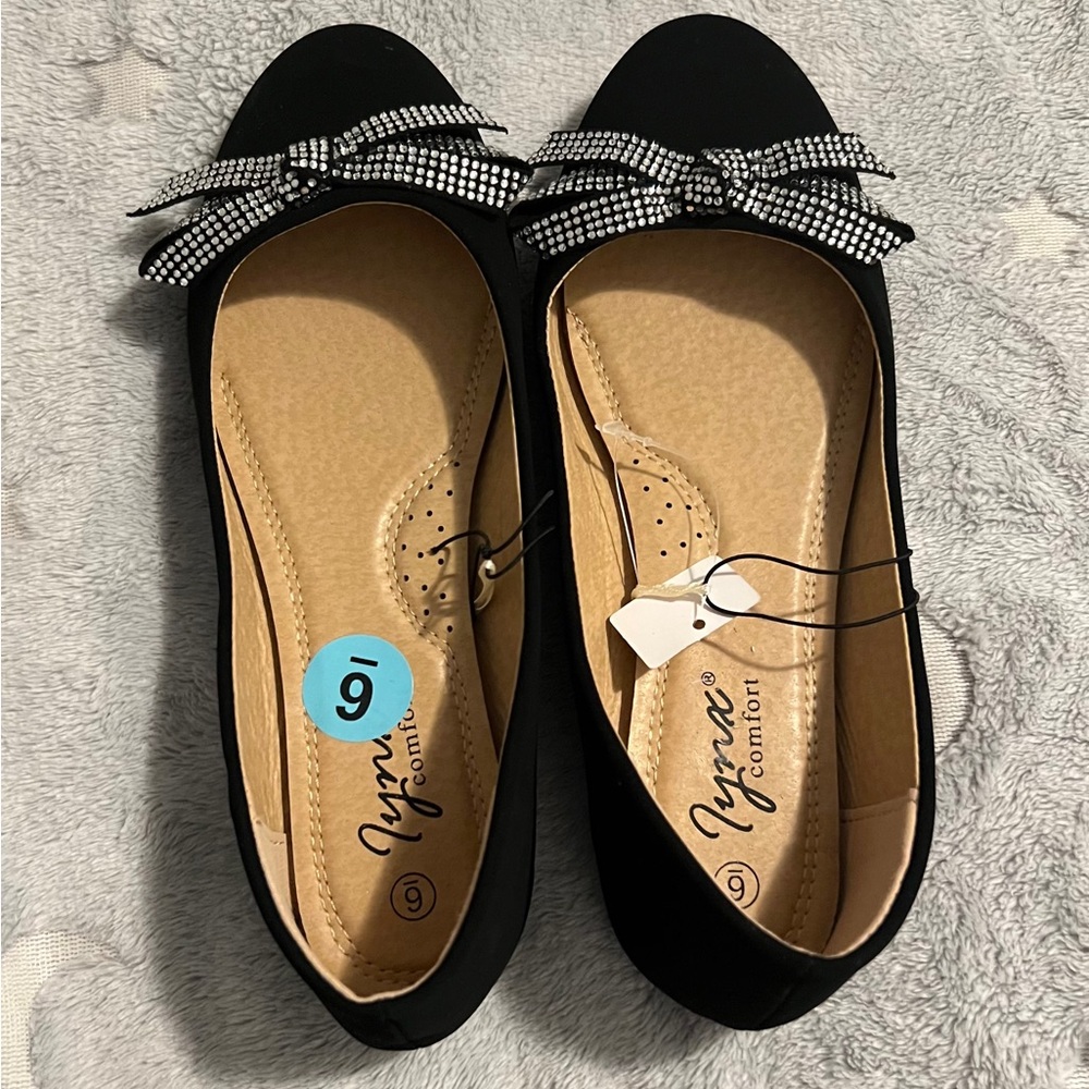 Iynx women's size 6 Black flats with silver rhinestones.